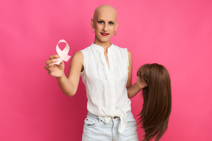 Cancer Survivor Hold Wig